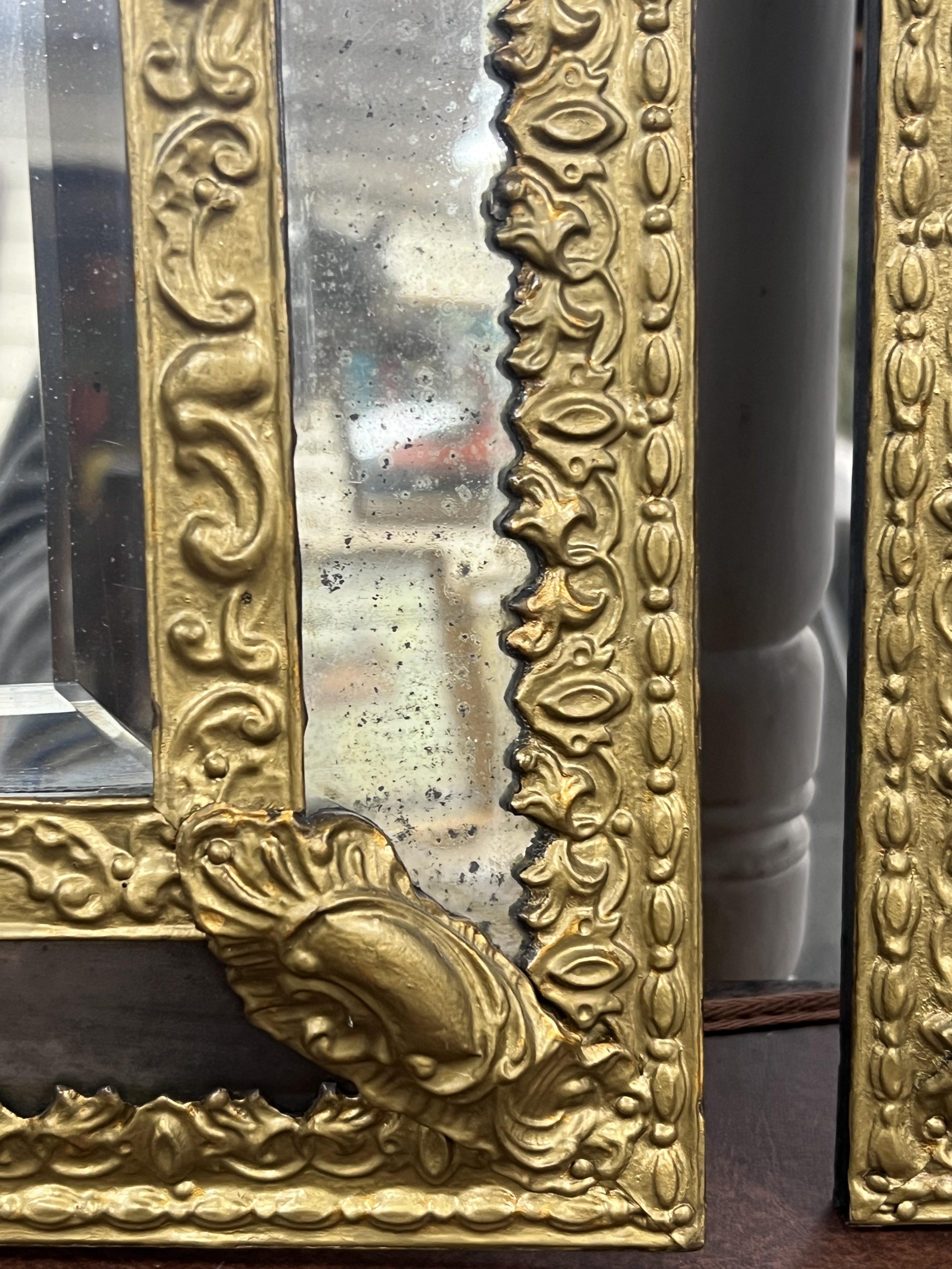 A pair of 19th century Dutch repousse wall mirrors, width 33cm, height 60cm